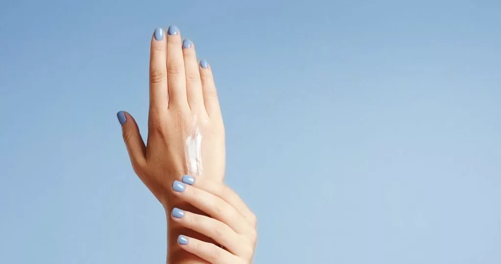 womans-hands-closeup-isolated-on-light-blue