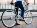 cropped-image-of-a-female-biker-riding-bicycle-on-street