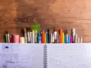 various-school-and-art-supplies-wooden-table-copy-space-2