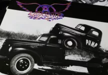 Closeup of rock band Aerosmith vinyl record album cover Pump from 1989 (focus on center)