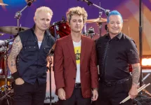 Mike Dirnt^ Billie Joe Armstrong^ Tre Cool pose on stage during ABC Good Morning America rock group Green Day concert in Central Park in New York on July 26^ 2024