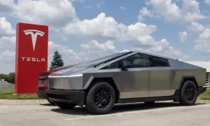 Tesla Cybertruck display at a dealership. Tesla claims the Cybertruck has a driving range of up to 340 miles. Indianapolis - May 19^ 2024: