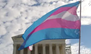 A transgender pride flag flies in front of the U.S. Supreme Court building in Washington^ DC.