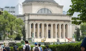 Students at the Columbia University campus on the Upper West Side of Manhattan. Steps of the Low Memorial Library in the background. New York^ NY^ USA - July 8^ 2022:
