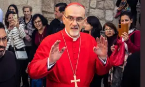 Cardinal Pierbattista Pizzaballa^ Latin Patriarch of Jerusalem^ greets the crowd as he leaves the Church of the Nativity after the Christmas celebrations. Bethlehem^ West Bank^ December 25^ 2025