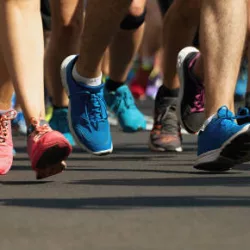 marathon-runners-running-on-city-roaddetail-on-legs