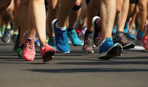 marathon-runners-running-on-city-roaddetail-on-legs