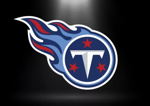 Tennessee Titans logo^ NFL Team^ based in Nashville^ south division^ Superbowl^ with spotlight background