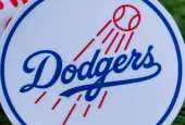 The emblem of the Los Angeles Dodgers baseball club and a baseball. September 26^ 2022^ Cooperstown^ New York