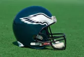 Philadelphia Eagles NFL club helmet on the green playing field ^ product shot