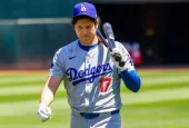 Los Angeles Dodgers designated hitter Shohei Ohtani walk on the field before a game against the Oakland Athletics at the Oakland Coliseum. Oakland^ California - August 4^ 2024