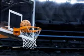 basketball going into hoop at arena (NBA)