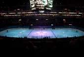 pro ice hokey rink lit up at nighttime