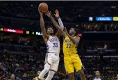 Realistic photography of two basketball players fighting in the air to catch the ball falling after a failed shot in an nba game. one basketball player is from the oklahoma city thunder and the other basketball player is from the indiana pacers. the photo