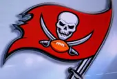 LOGO OF Tampa Bay Buccaneers. American football match^ silhouette of players.