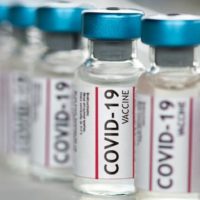istock_11421_covidvialslinedup