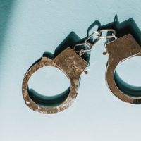 gettyimages_handcuffs_022822_royaltyfree