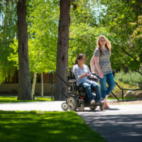 two-female-students-on-upper-campus-in-spring