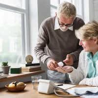 senior-adult-taking-pills-medicine-concept