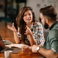 colleagues-in-office-businesswoman-and-businessman-discussing-w