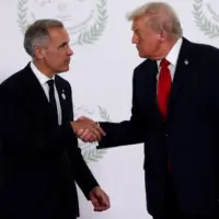 getty_trumpcarney_102425545877