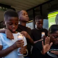 getty_candlelitvigiljohnsonfamily_042126_0760276