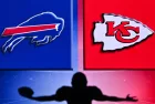 Buffalo Bills vs Kansas City Chiefs. . Silhouette of professional american football player. Logo of NFL club in background