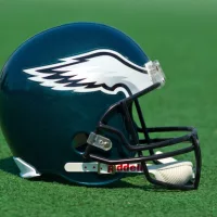 Philadelphia eagles NFL club helmet on the green playing field ^ product shot