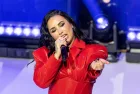 Demi Lovato wearing dress by Michael Ngo performs on stage during American Heart Association Go Red for Women and Red Dress Collection Concert at Jazz at Lincoln Center in New York on Jan 31^ 2024.