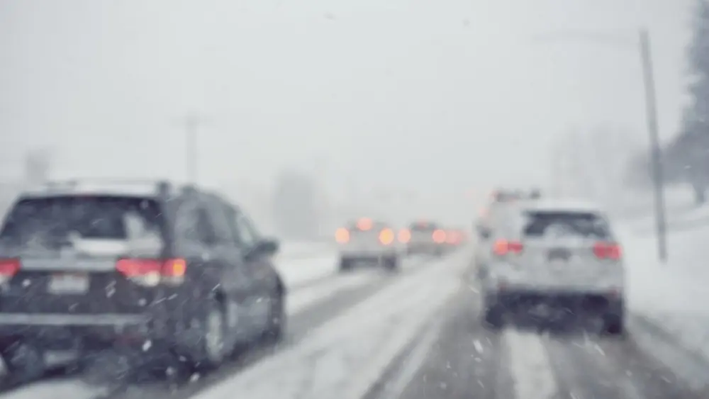 cars-driving-on-road-in-winter-storm631426