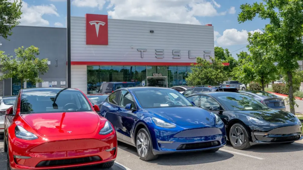 tesla-model-y-vehicles-sit-on-the-lot-for-sale-at-a-tesla-car-dealership-in-austin-texas813739