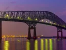 Francis Scott Key bridge with Baltimore skyline at night