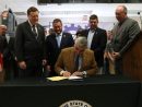 holcomb-signing-bill
