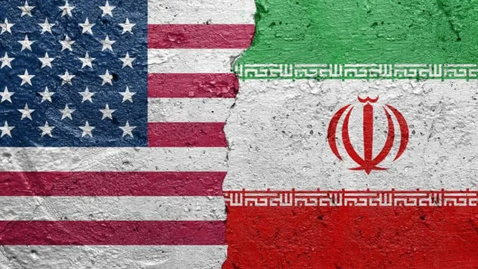 United States of America vs Iran - Cracked concrete wall painted with a USA flag on the left and a Iranian flag on the right