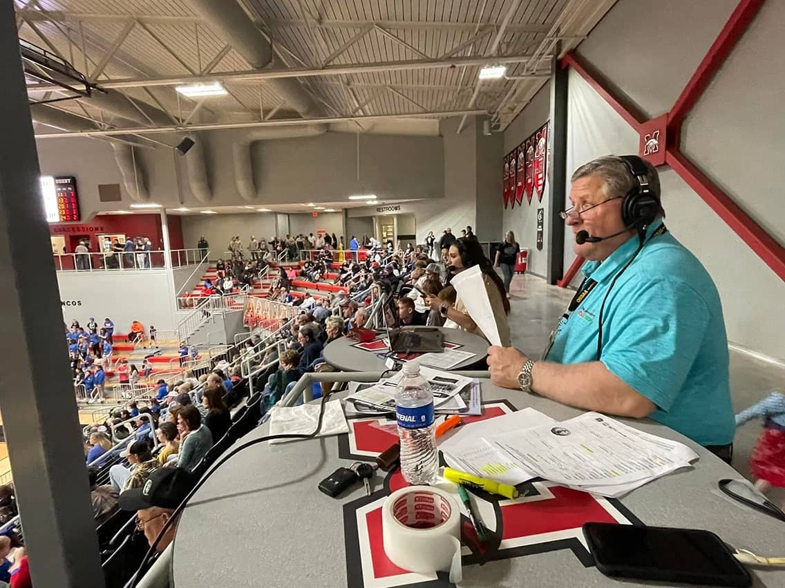 Shawn Wilson broadcasting basketball from a State playoff game