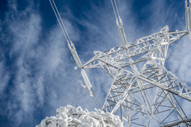 high-voltage-electric-tower-on-a-snowy-day-in-the-mountains