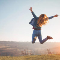 happy-jump-by-girl-in-nature