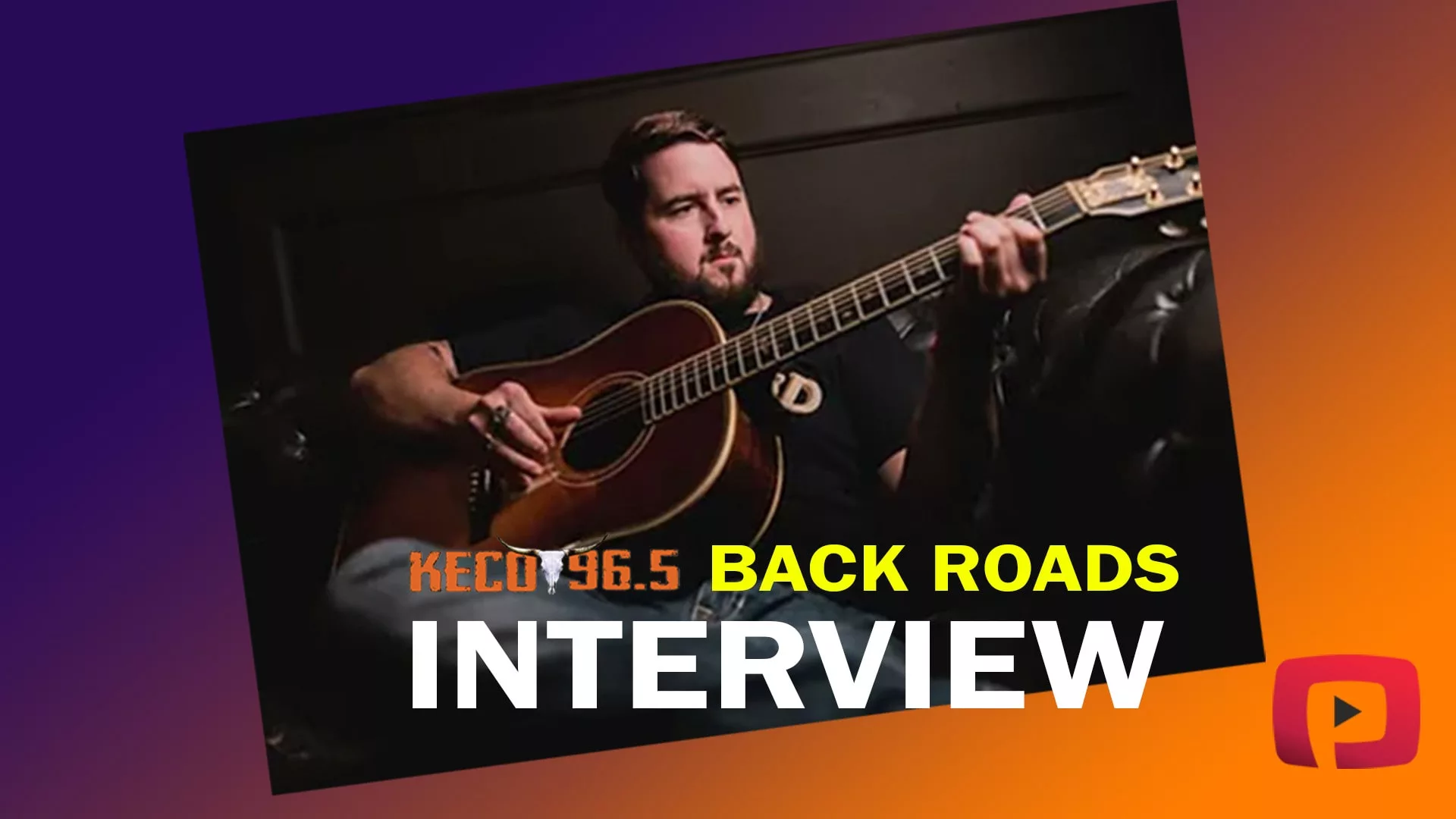 Jake Bush playing his guitar during the Backroads interview