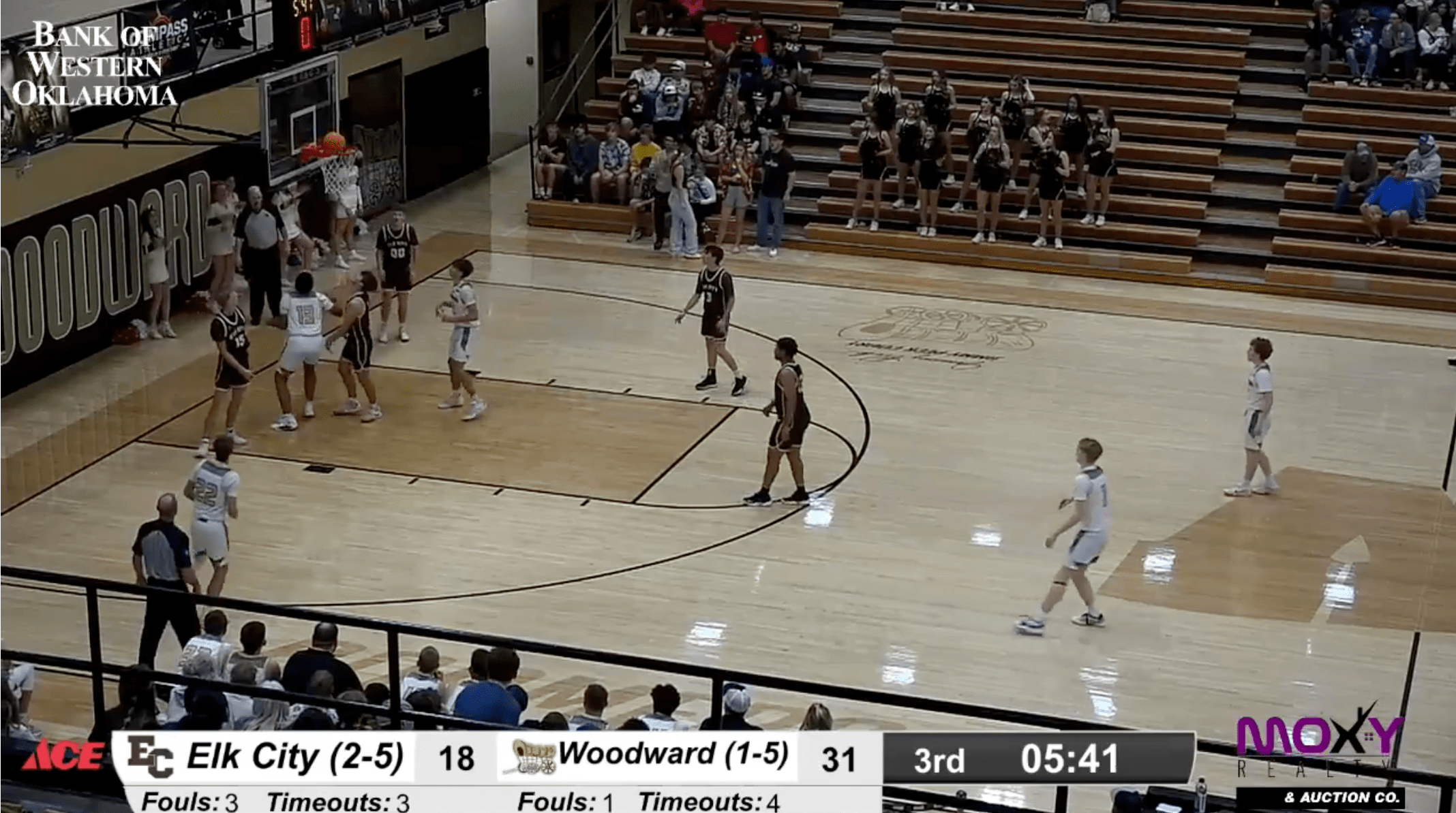 Elk City vs. Woodward Boys Basketball Game - Intense Court Action