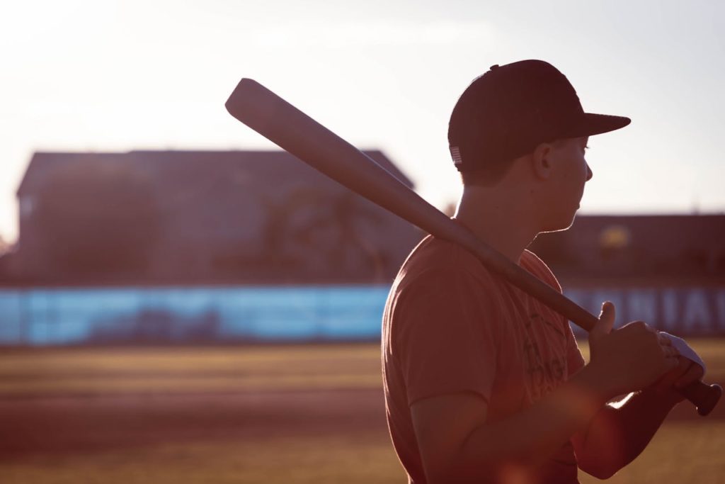 High School Baseball Player Holding Bat