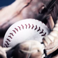 Close-up of a baseball in a glove