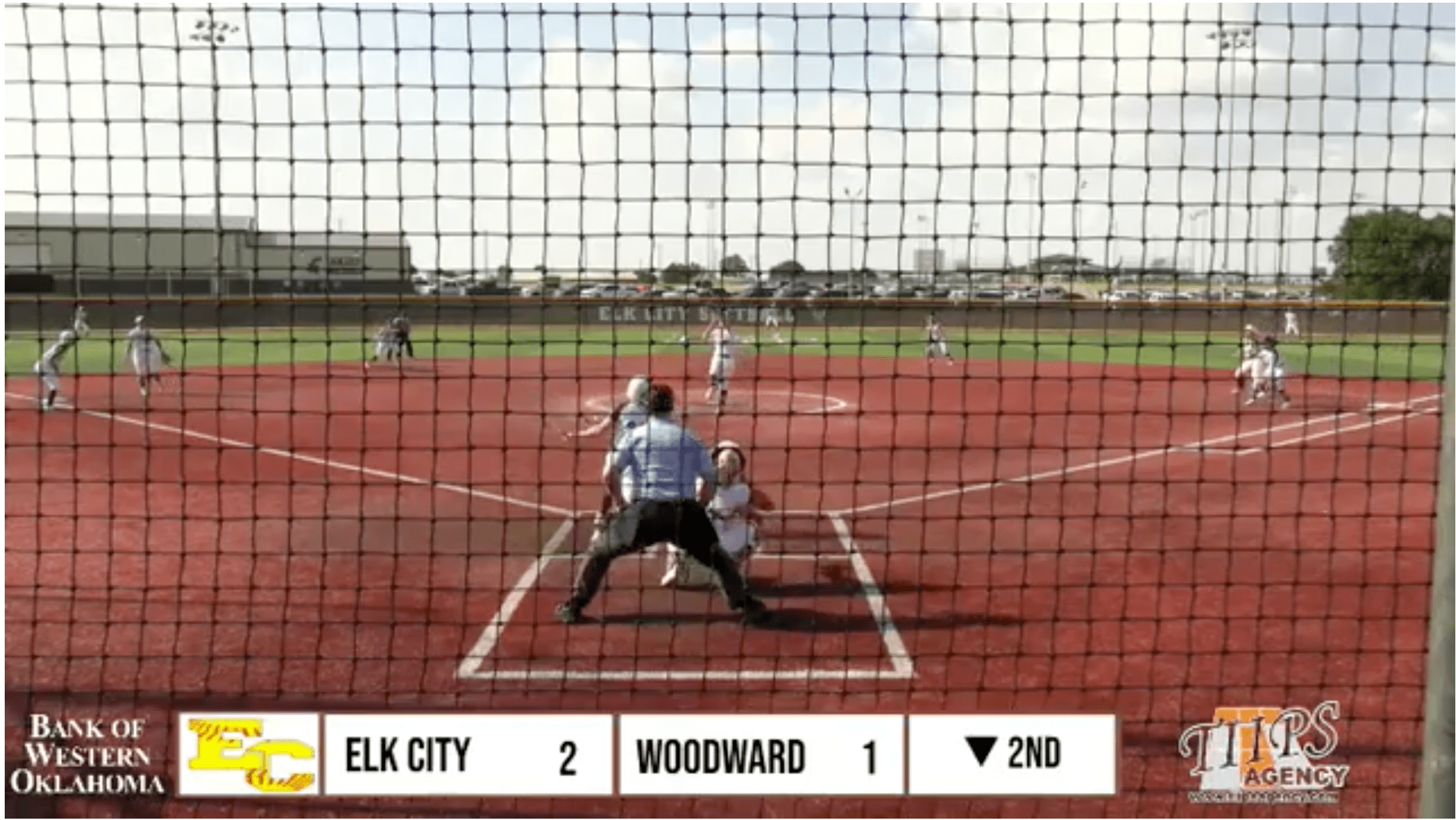 Elk City Elkettes softball team in action against Woodward, securing an 11-1 victory in a District 4A-1 game.