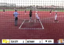 Elk City softball player rounding home plate as the team scores two runs against Bethany in the 10th inning.