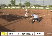 Elk City Elkette softball player at bat against Weatherford Lady Eagles during district championship game.