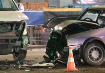 damaged-in-heavy-car-accident-vehicles-after-collision-on-city-street-crash-site-at-night-road-safety-and-insurance-concept