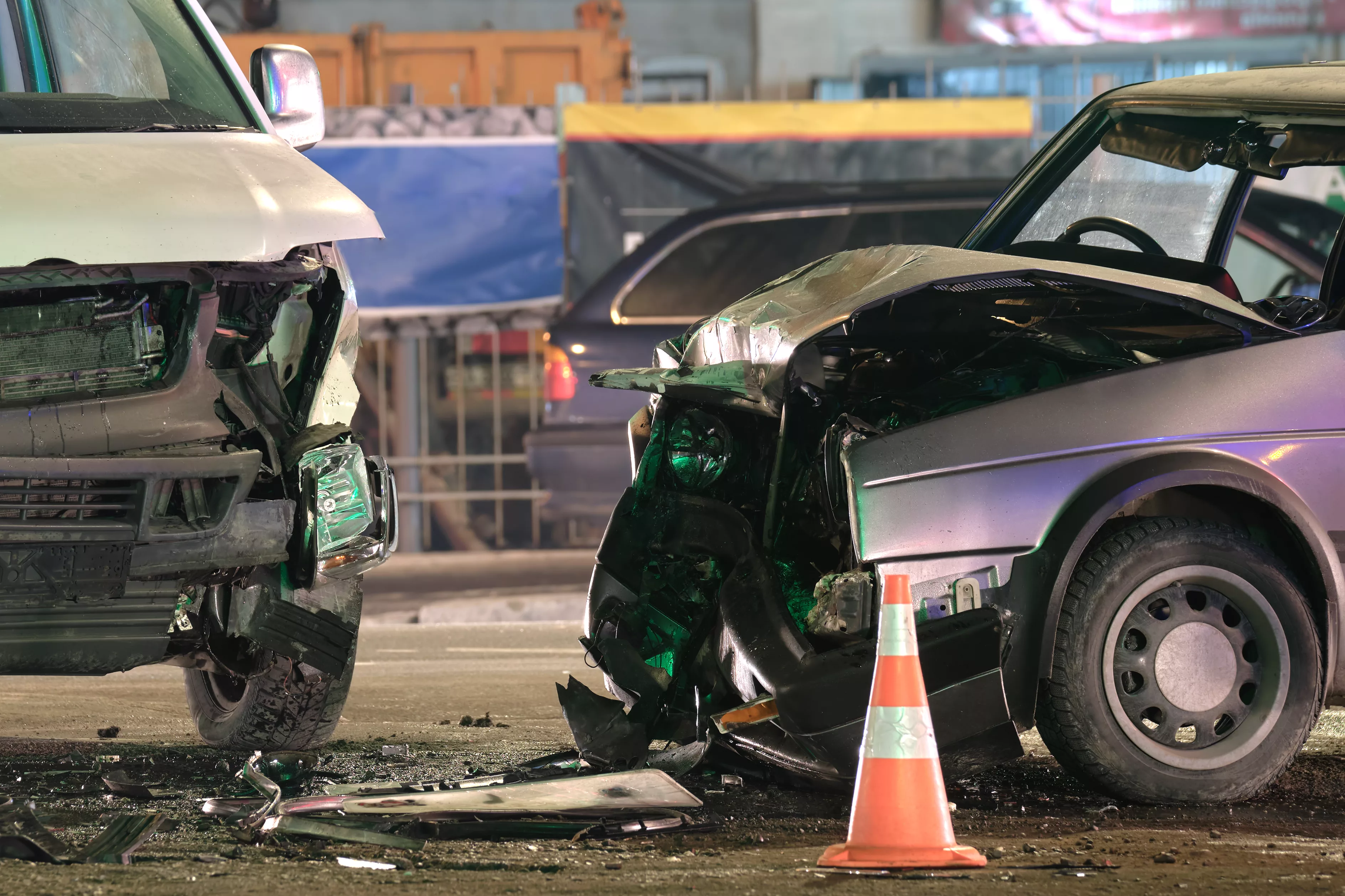 damaged-in-heavy-car-accident-vehicles-after-collision-on-city-street-crash-site-at-night-road-safety-and-insurance-concept