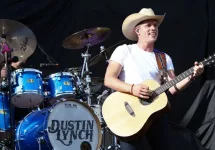 Dustin Lynch performs during the 'Kick The Dust Up' Tour at Vanderbilt Stadium on July 11^ 2015 in Nashville^ Tennessee.