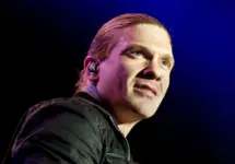 Brent Smith of Shinedown against a black and blue background at Rockstar Uproar Festival on September 25 2012 in Nampa^ Idaho.