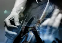country artist/Guitarist with the audience in a double exposure