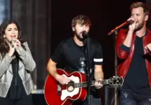 (L-R) Hillary Scott^ Dave Haywood and Charles Kelley of Lady A perform during the You Look Good World Tour at Jones Beach Theatre on July 14^ 2017 in Wantagh^ New York.
